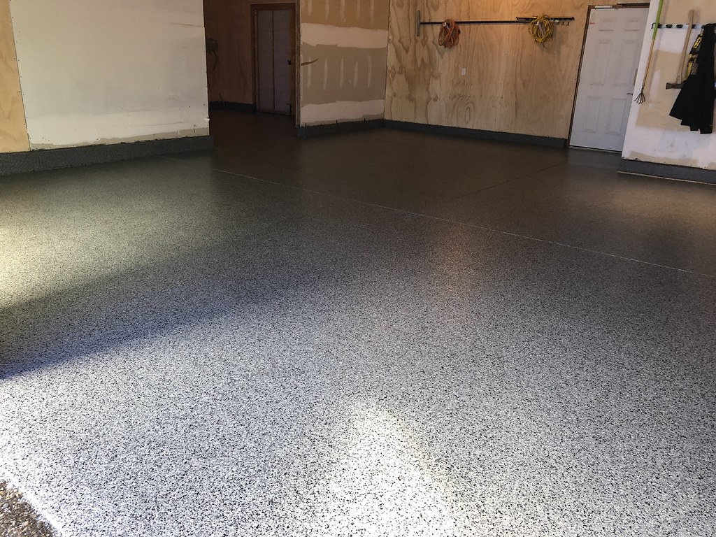 Fresh flake epoxy garage floor under renovation