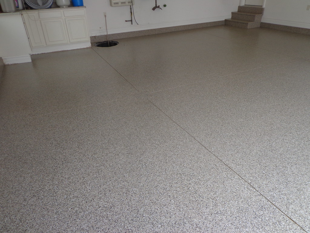 Flake epoxy garage with coated stairs and stem walls