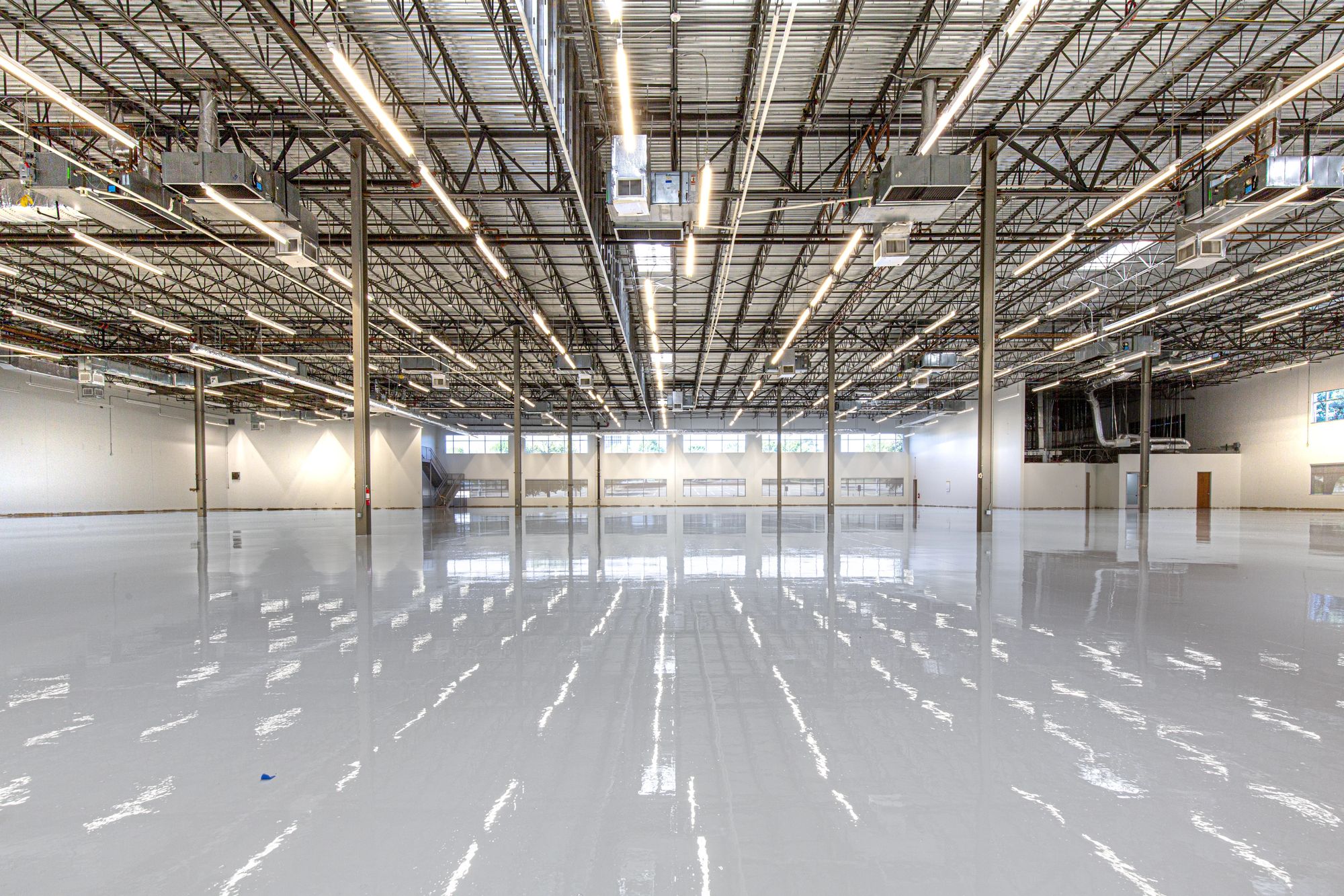 High-gloss commercial epoxy floor in an industrial facility